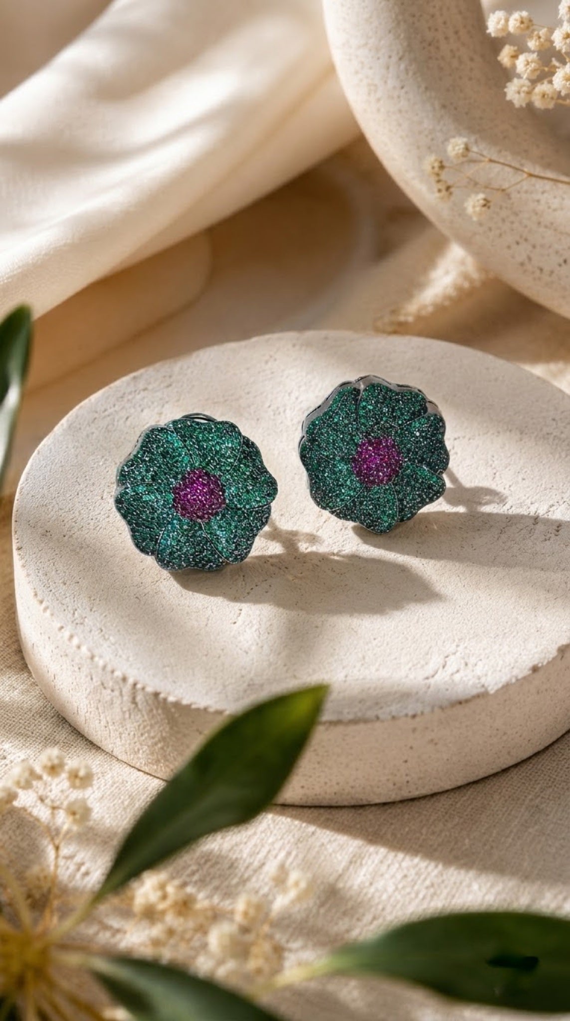 Green shimmer flower stud earrings with purple centre