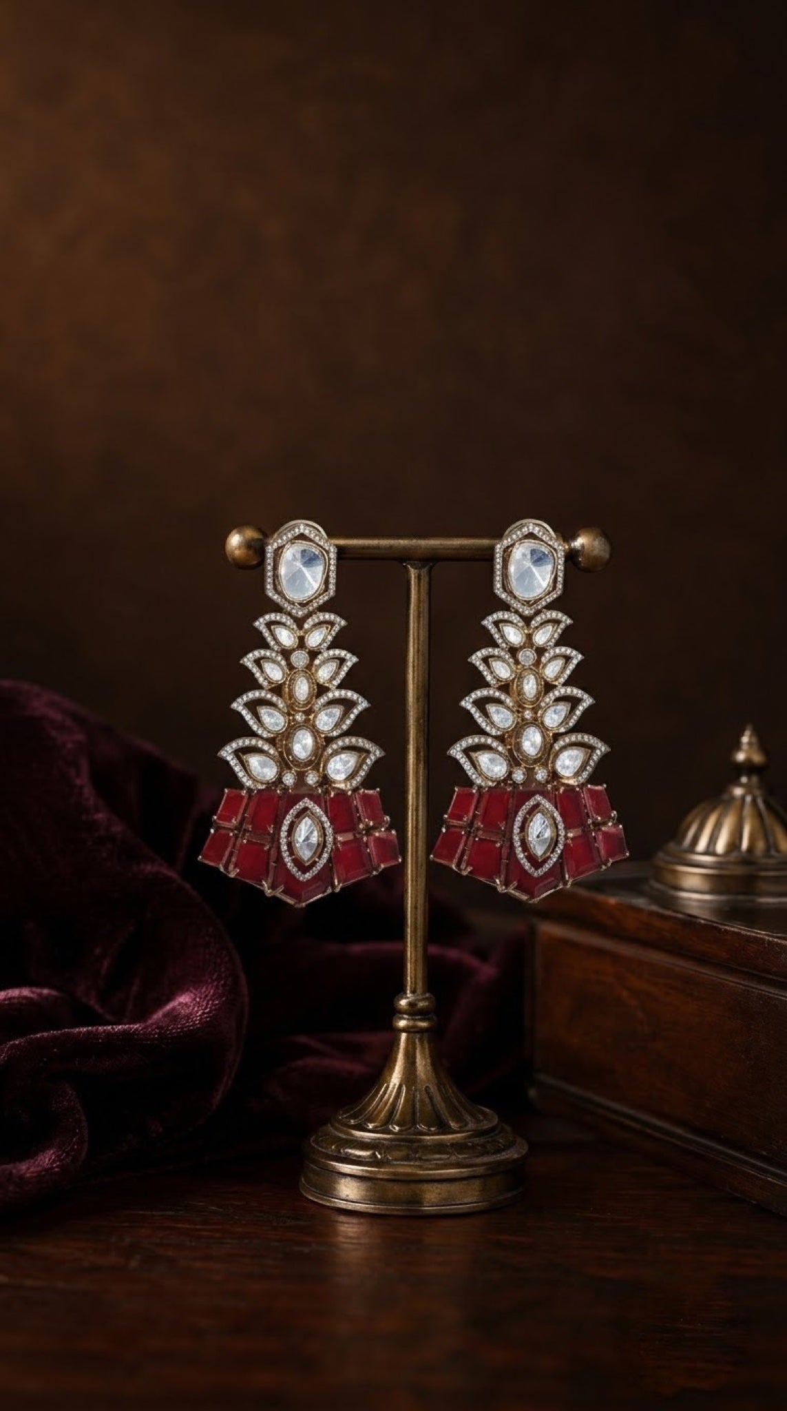 Antique gold-tone tiered earrings with polki-look stones and red base