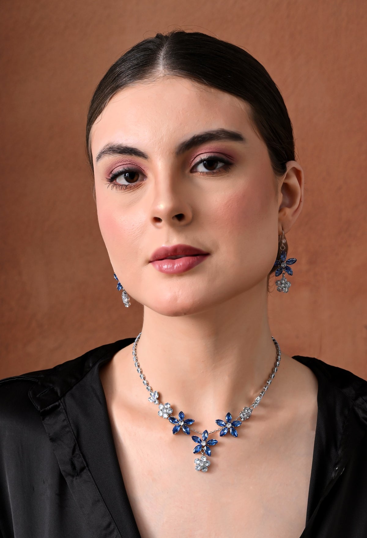 Silver-tone necklace set with blue crystal starflowers and clear crystal blossoms