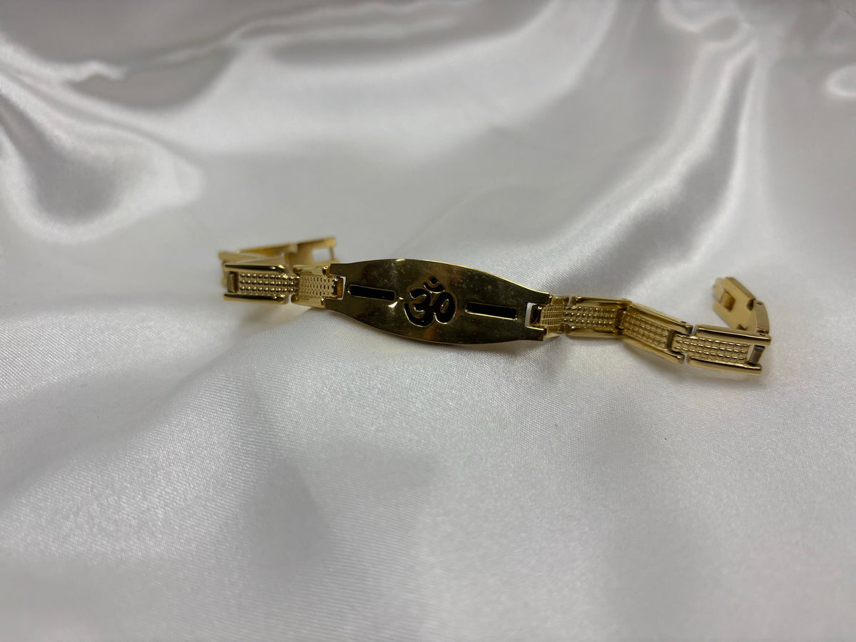 Gold-tone bracelet with Om cut-out plaque and textured links
