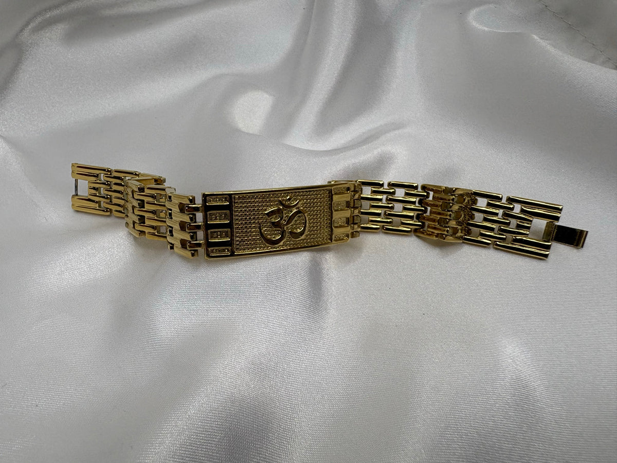 Gold-tone wide brick-link bracelet with large Om plaque