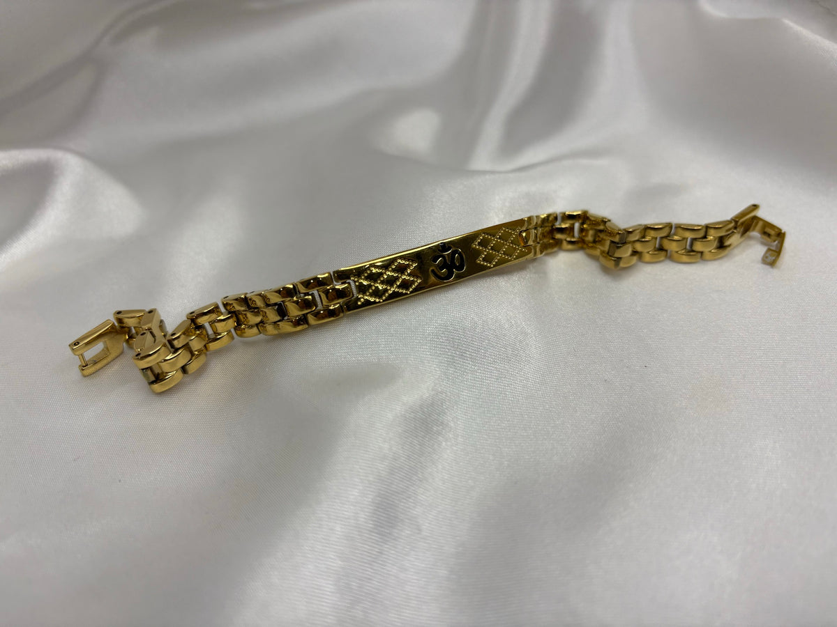 Gold-tone panther-link bracelet with Om lattice-engraved ID bar