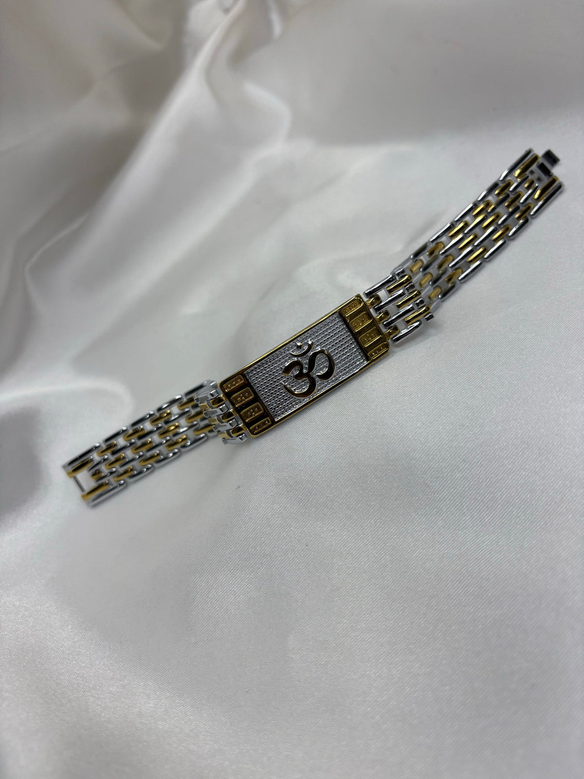 Dual-tone gold and silver brick-link bracelet with Om plaque