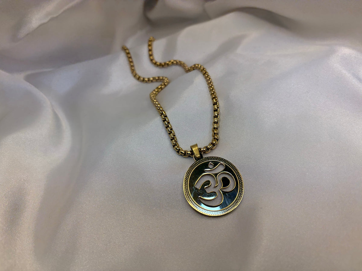 Gold-tone Om medallion pendant with beaded rim on box chain