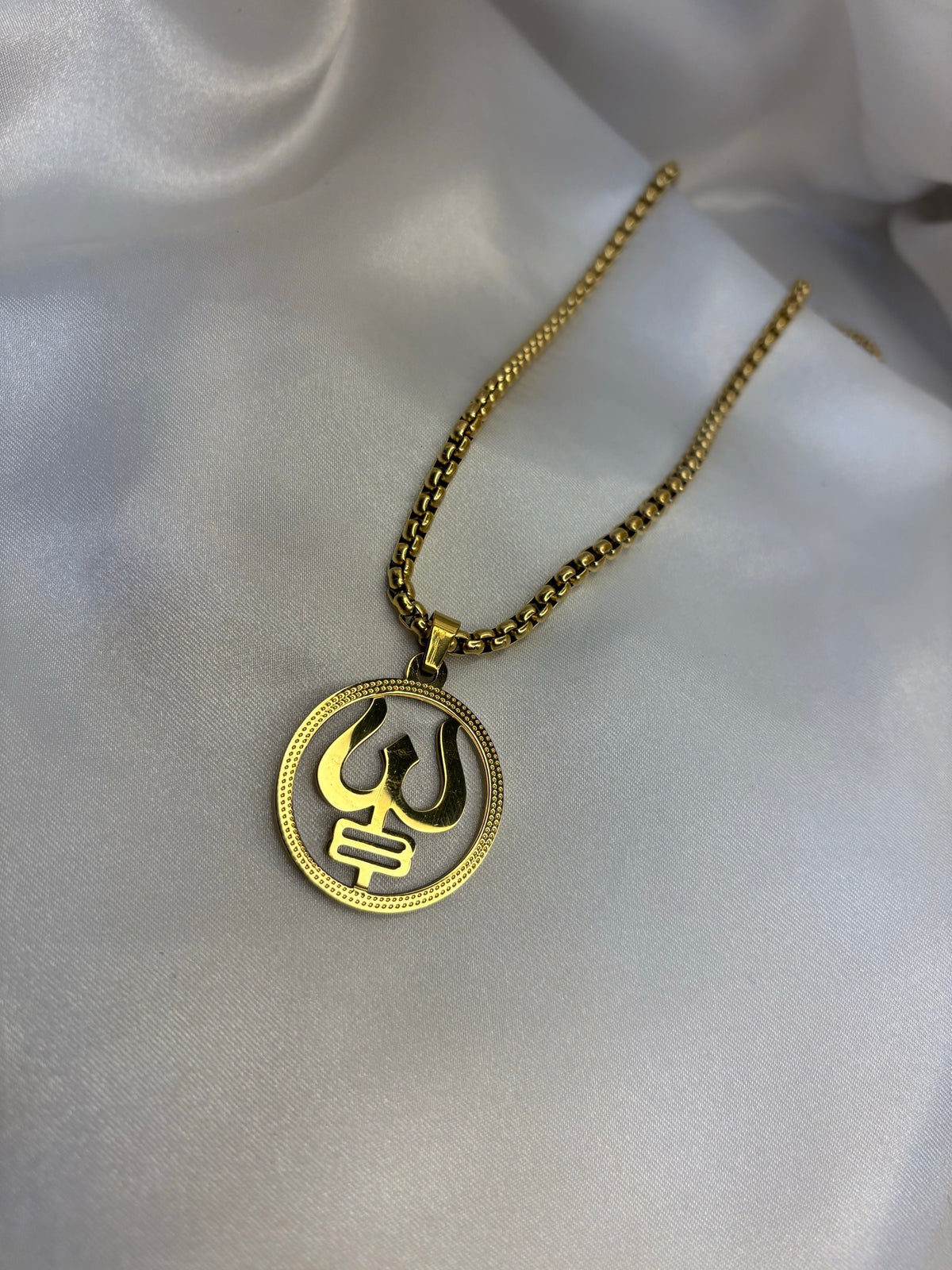 Gold-tone trishul inside open circle pendant on box chain