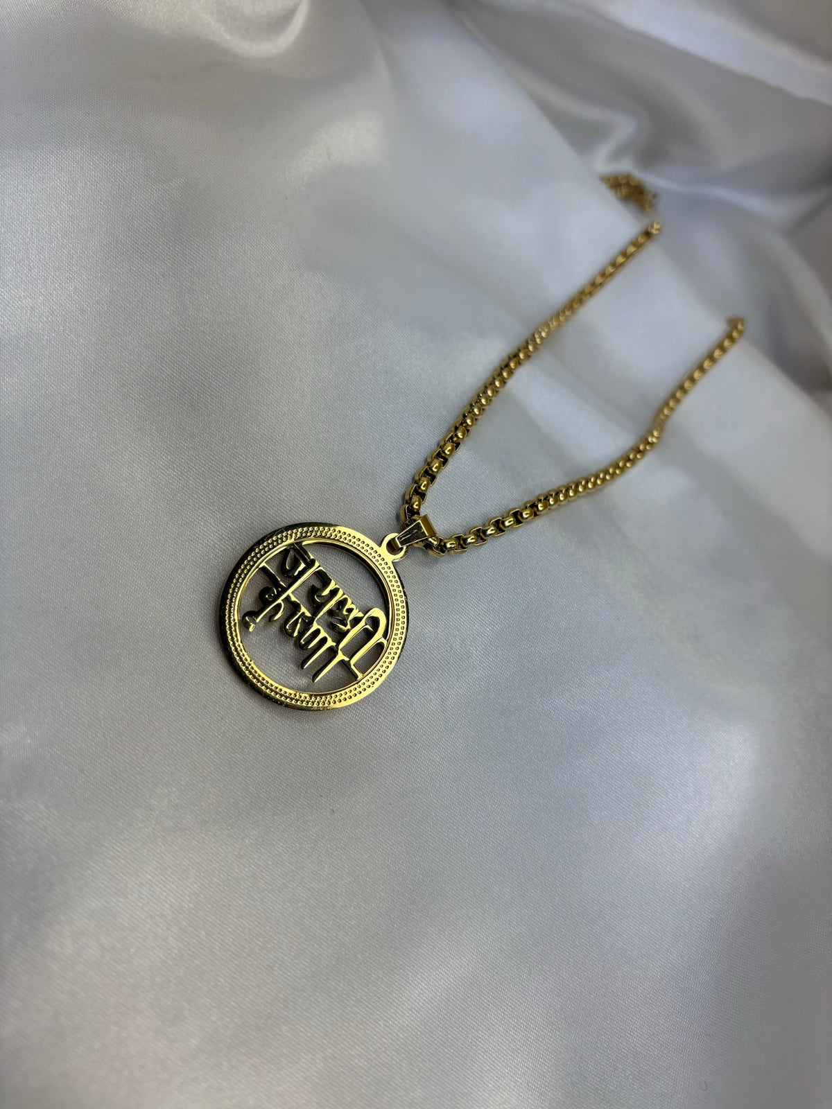 Gold-tone Jai Shree Krishna lettering open circle pendant on box chain