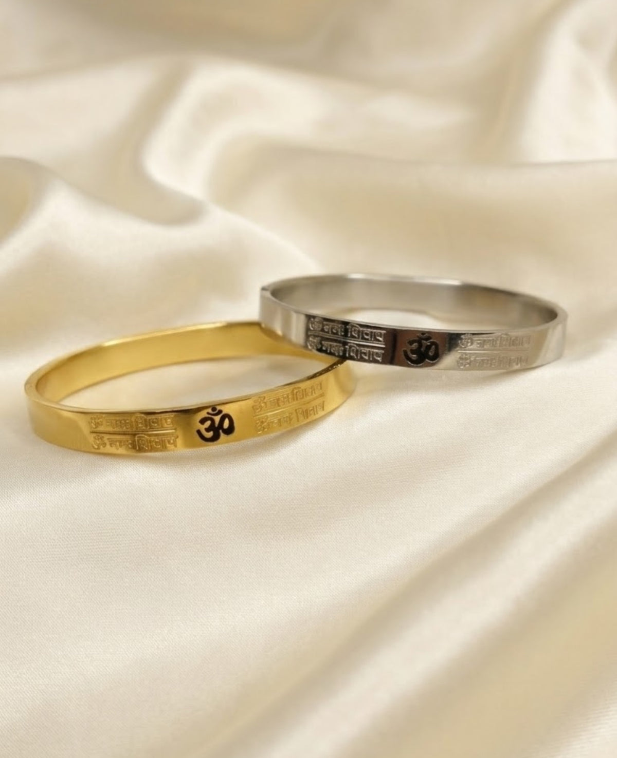 Om mantra engraved kada bracelet with black Om symbol and Devanagari script panels