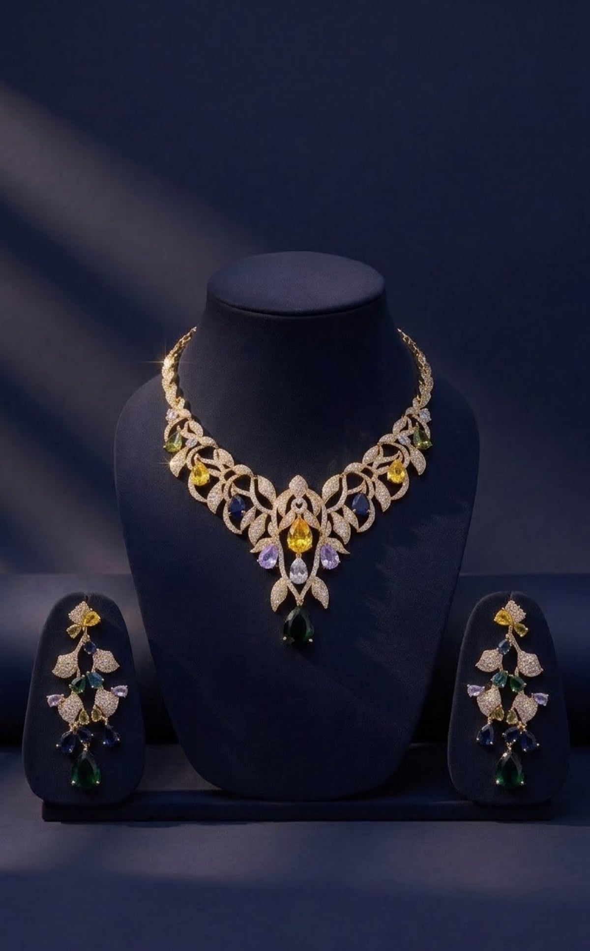 Gold-tone leaf vine bib necklace set with multicolour crystal drops