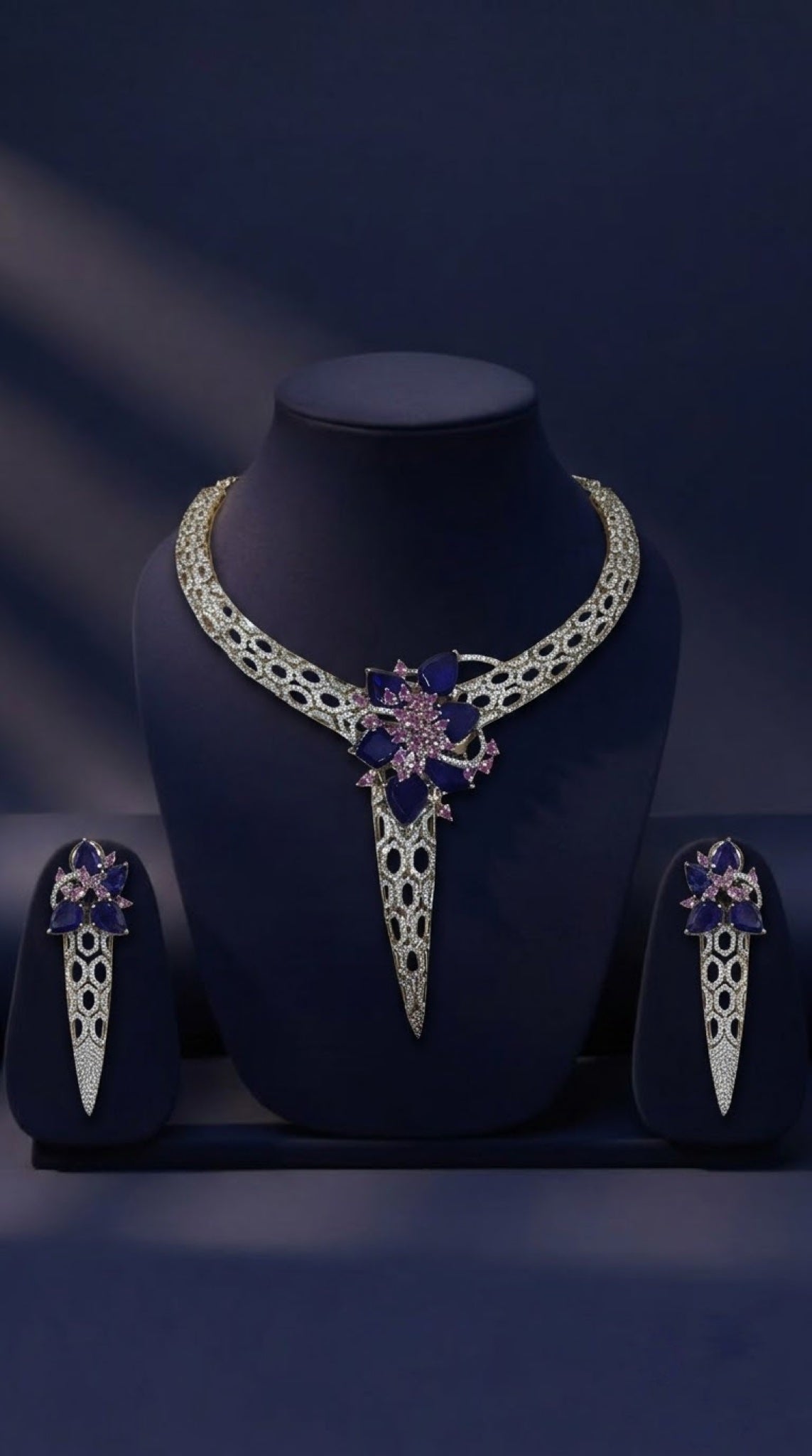 Silver-tone lattice collar necklace set with sapphire-blue and pink floral cluster
