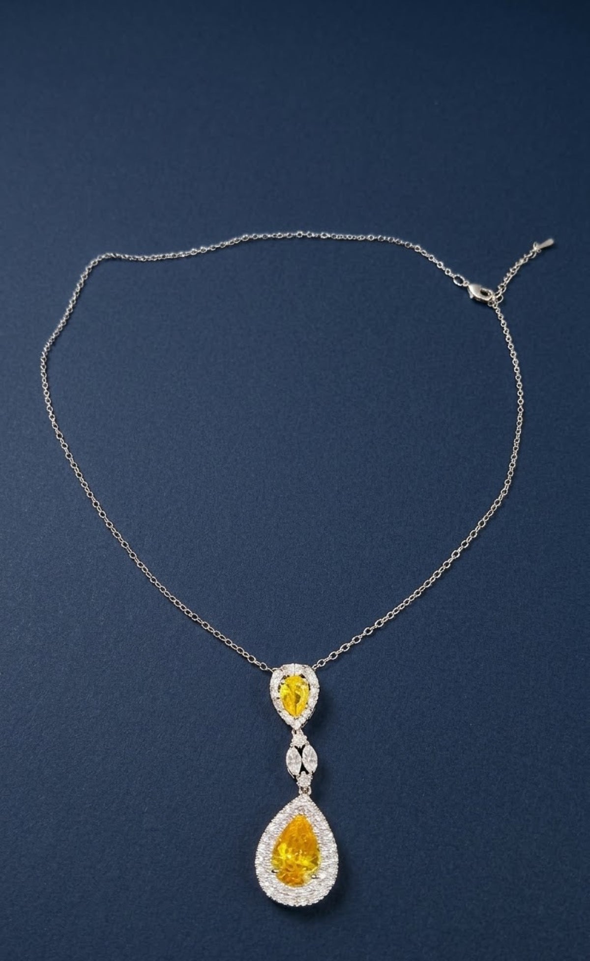 Silver-tone pendant set with yellow teardrop stones and crystal halos - view 2