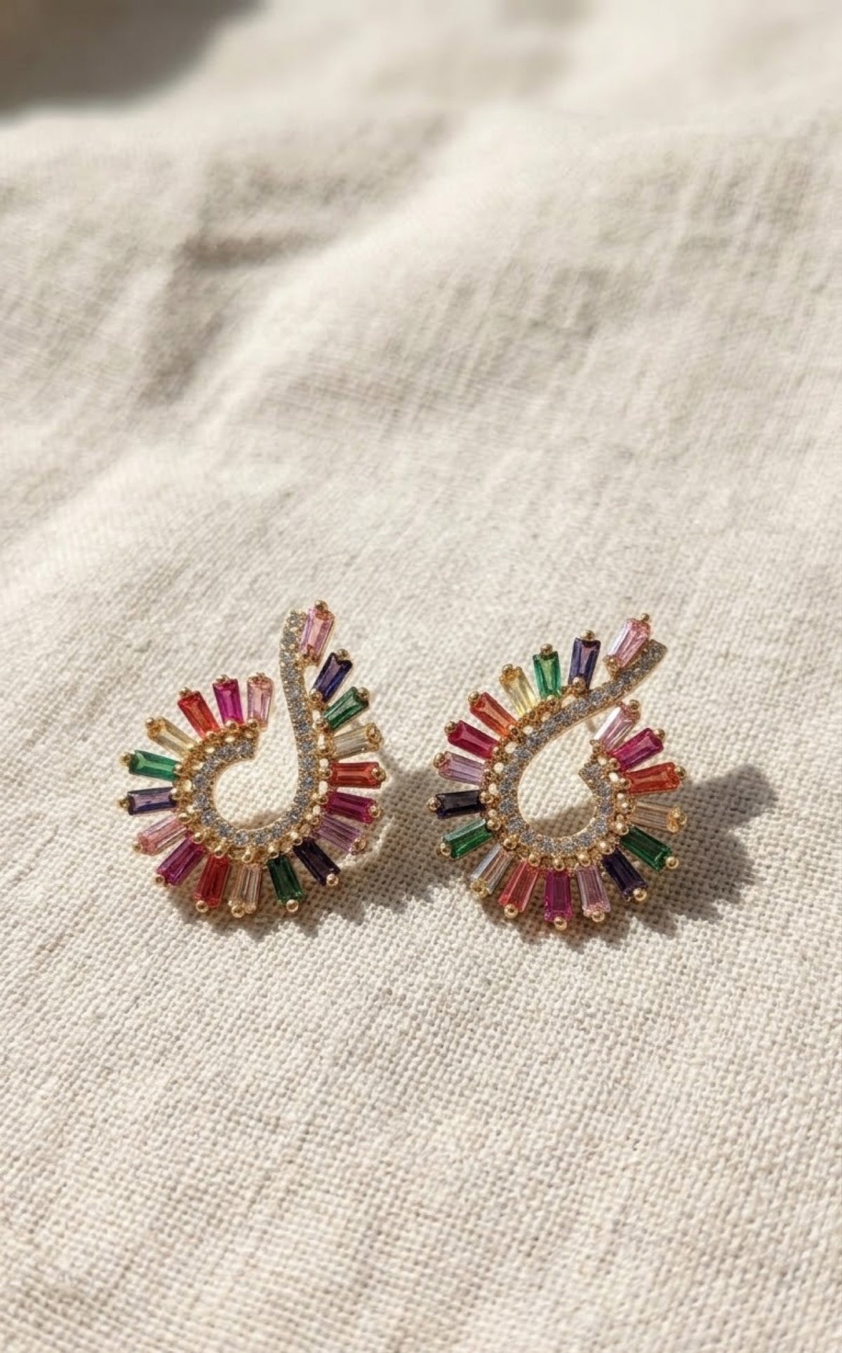 Gold-tone swirl pendant set with rainbow baguette stones - view 2