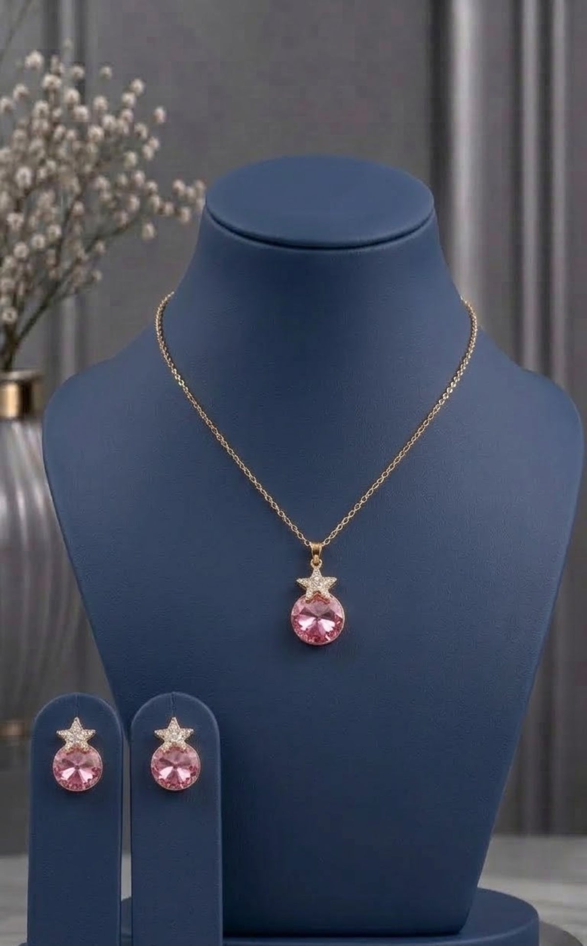 Gold-tone pendant set with pink crystal orb and star accent