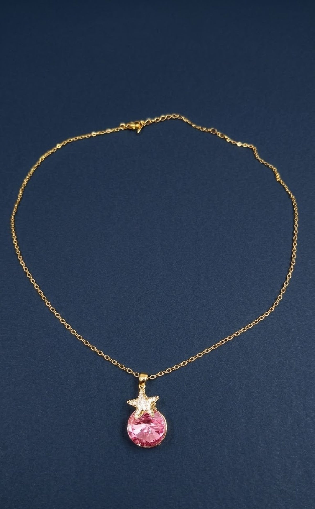 Gold-tone pendant set with pink crystal orb and star accent - view 2