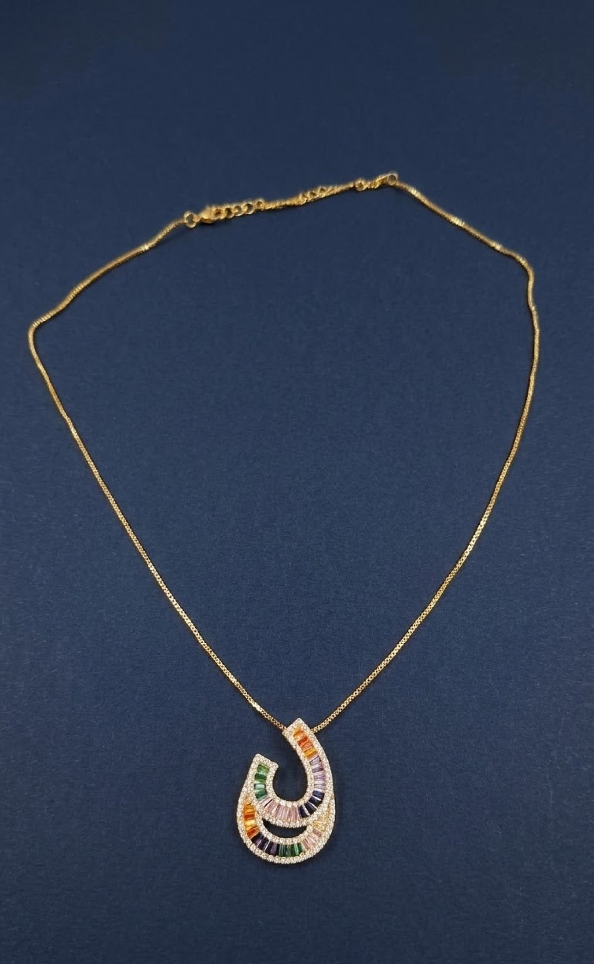 Gold-tone crescent loop pendant set with multicoloured baguettes - view 2