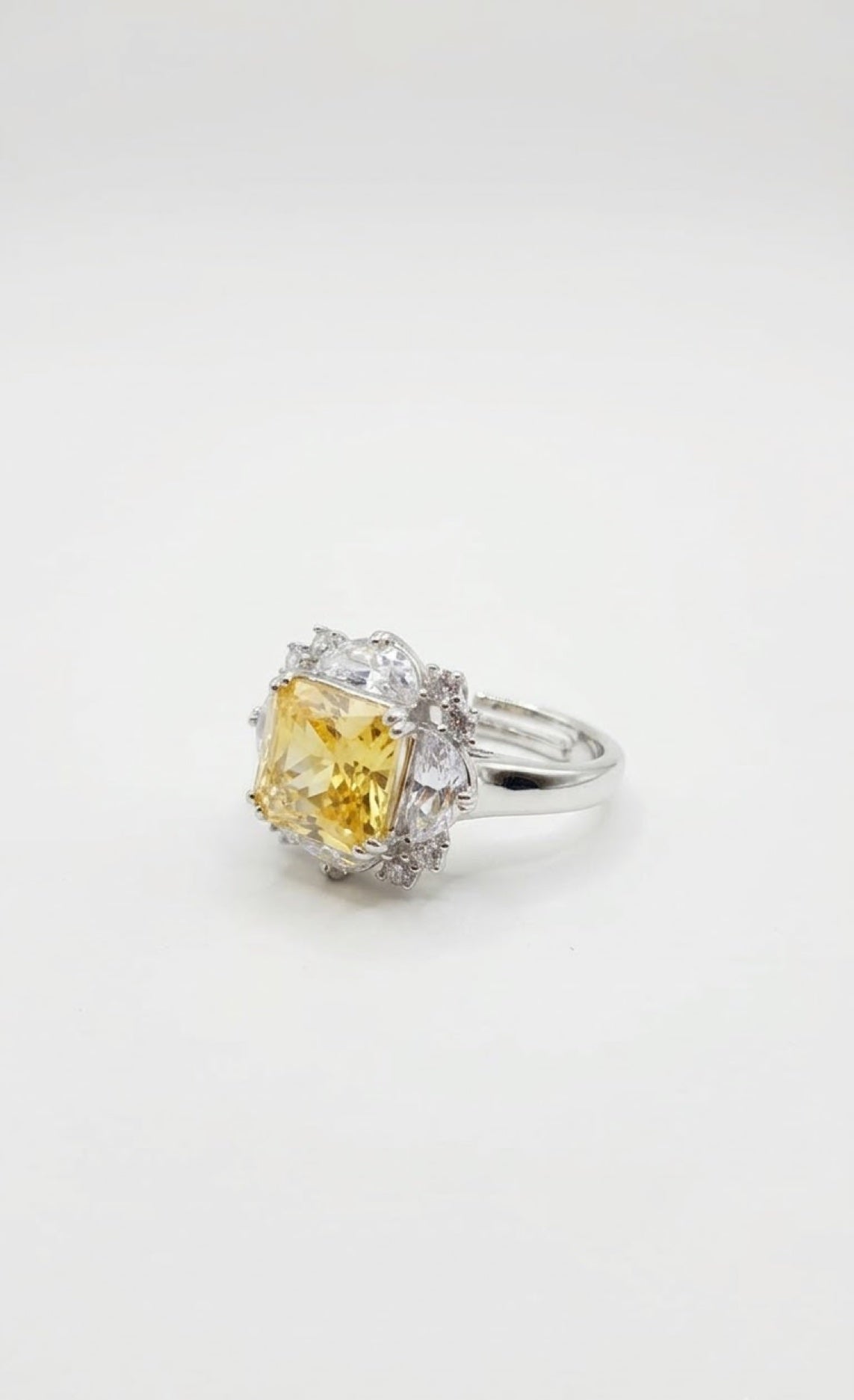 Silver-tone halo ring with an octagon-cut yellow crystal framed by clear diamond-look crystals - view 3