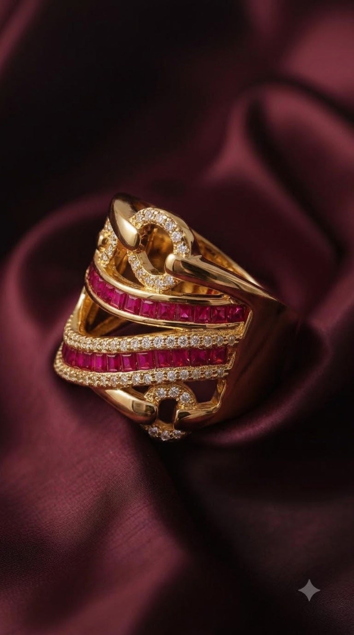 Wide gold-tone statement ring with ruby-red baguette crystals and pavé crystal bands