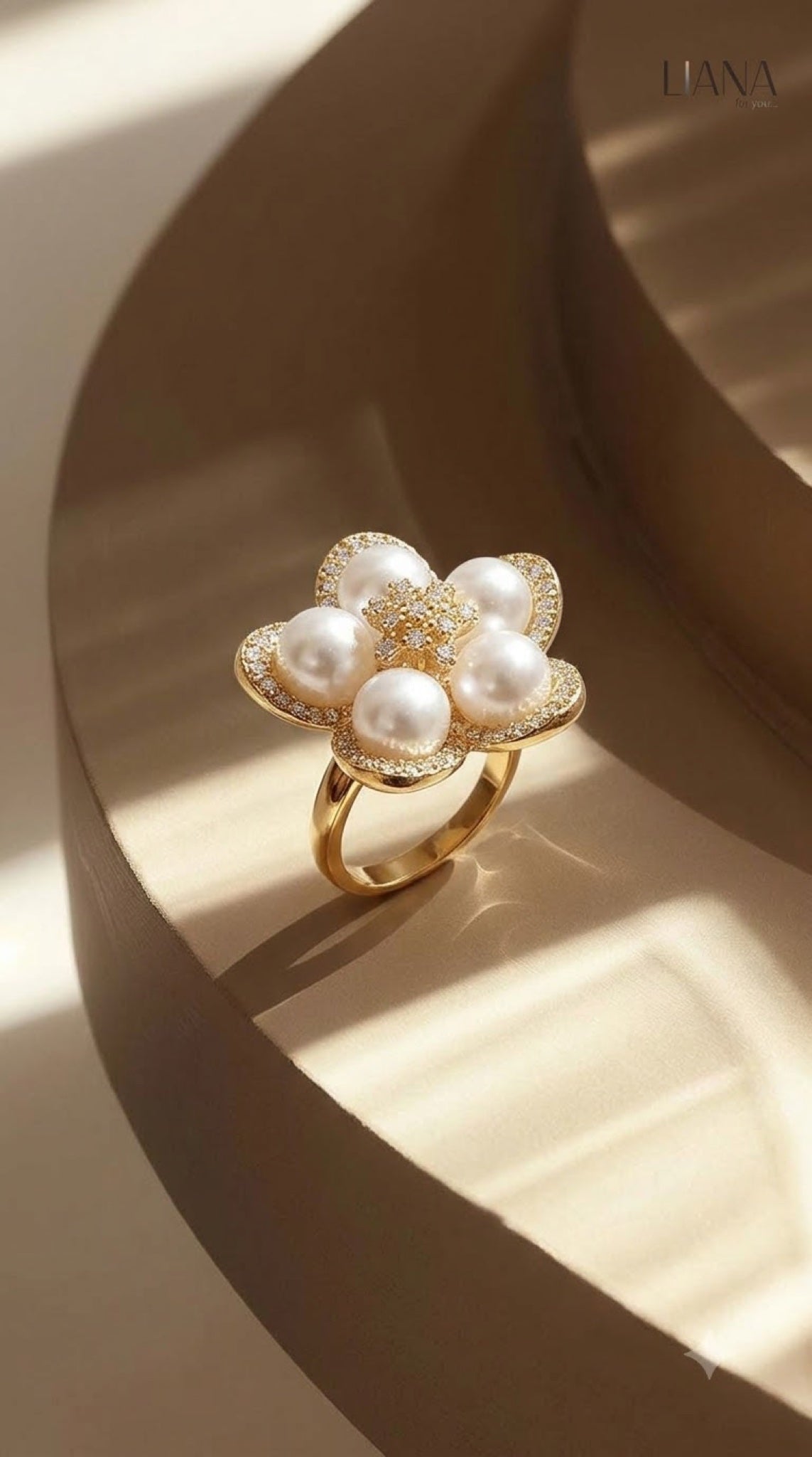 Gold-tone flower cocktail ring with faux pearl cluster and crystal-edged petals