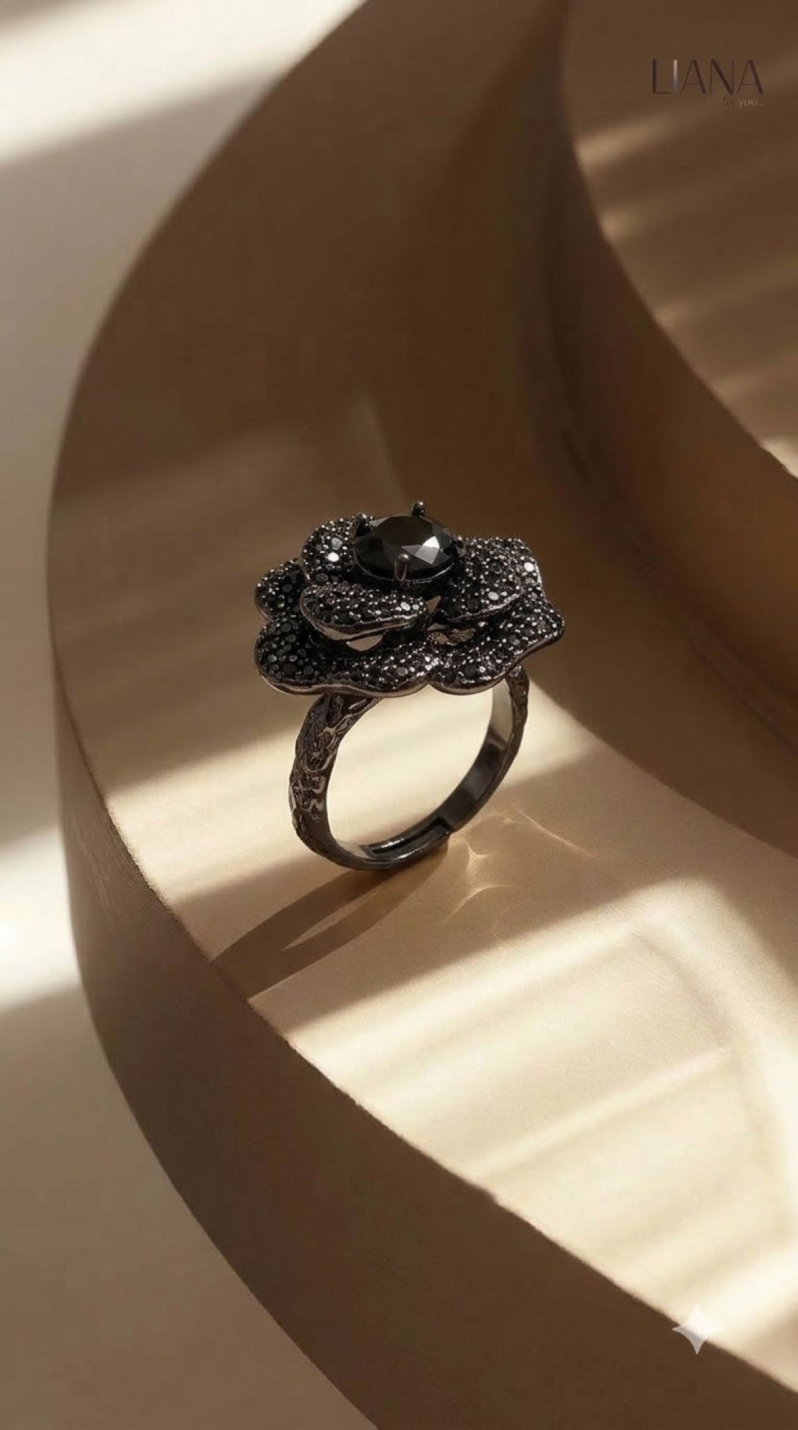 Black gunmetal-finish camellia flower ring with black crystal pavé