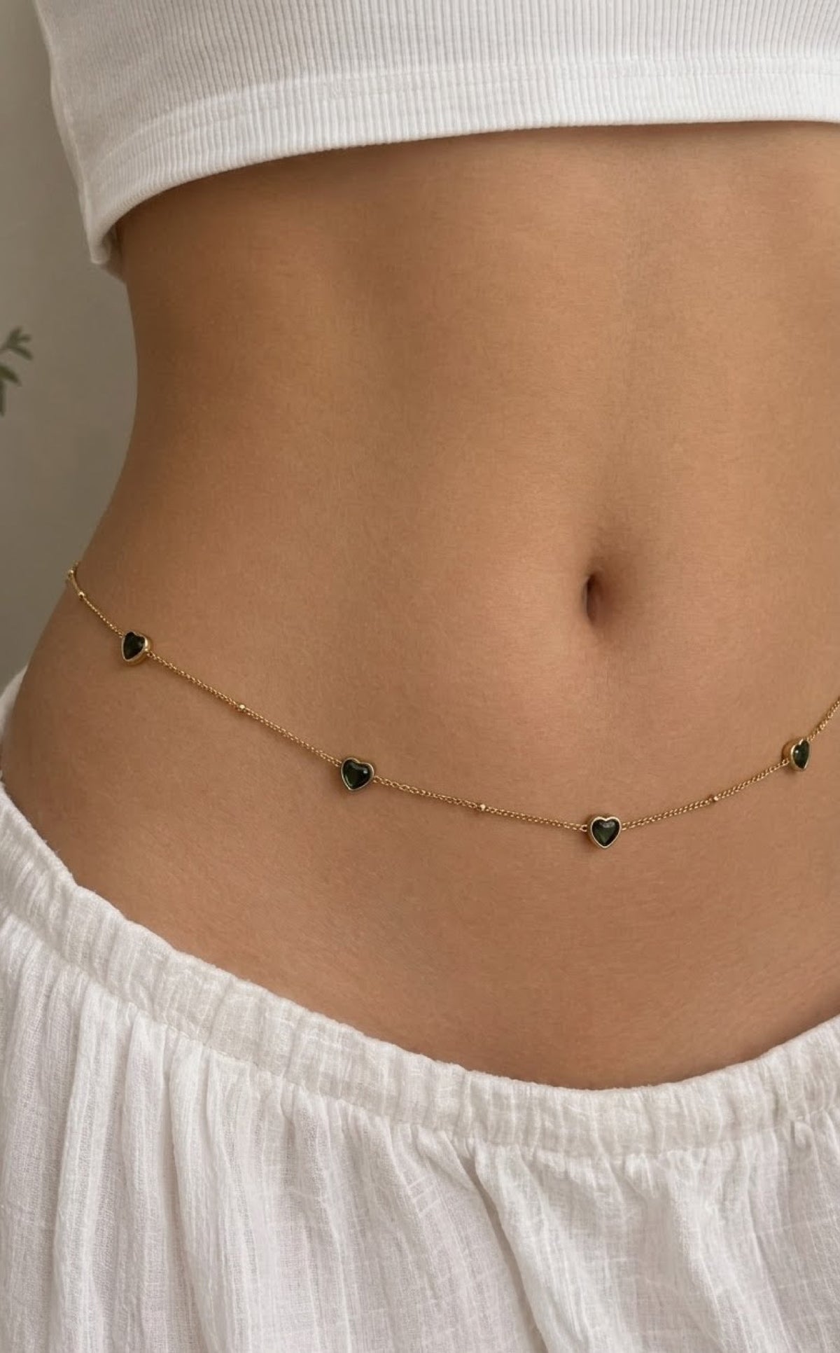 Gold-tone satellite waist chain with green heart stones