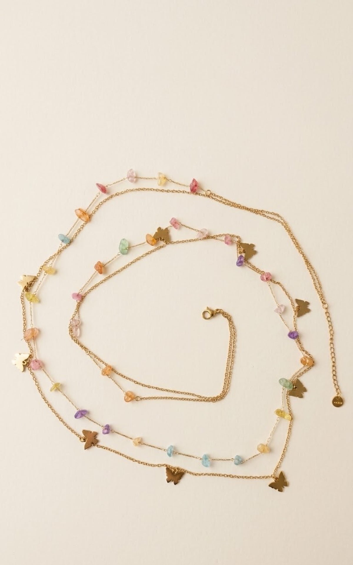 Layered gold-tone waist chain with pastel stone chips and butterfly charms - view 2