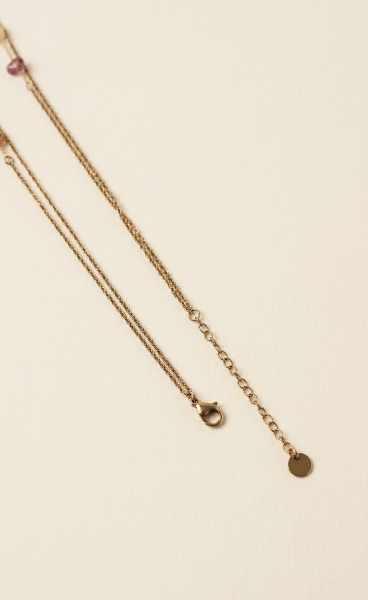 Layered gold-tone waist chain with pastel stone chips and butterfly charms - view 3