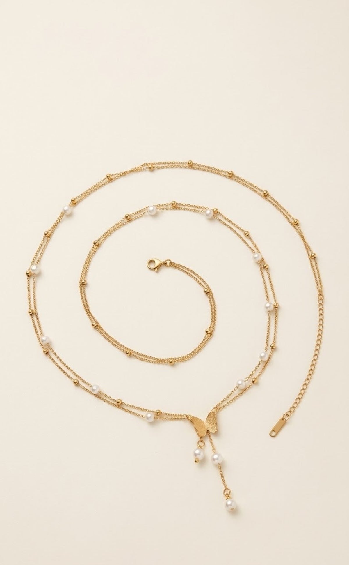 Double gold-tone waist chain with faux pearls and butterfly tassel drop - view 2