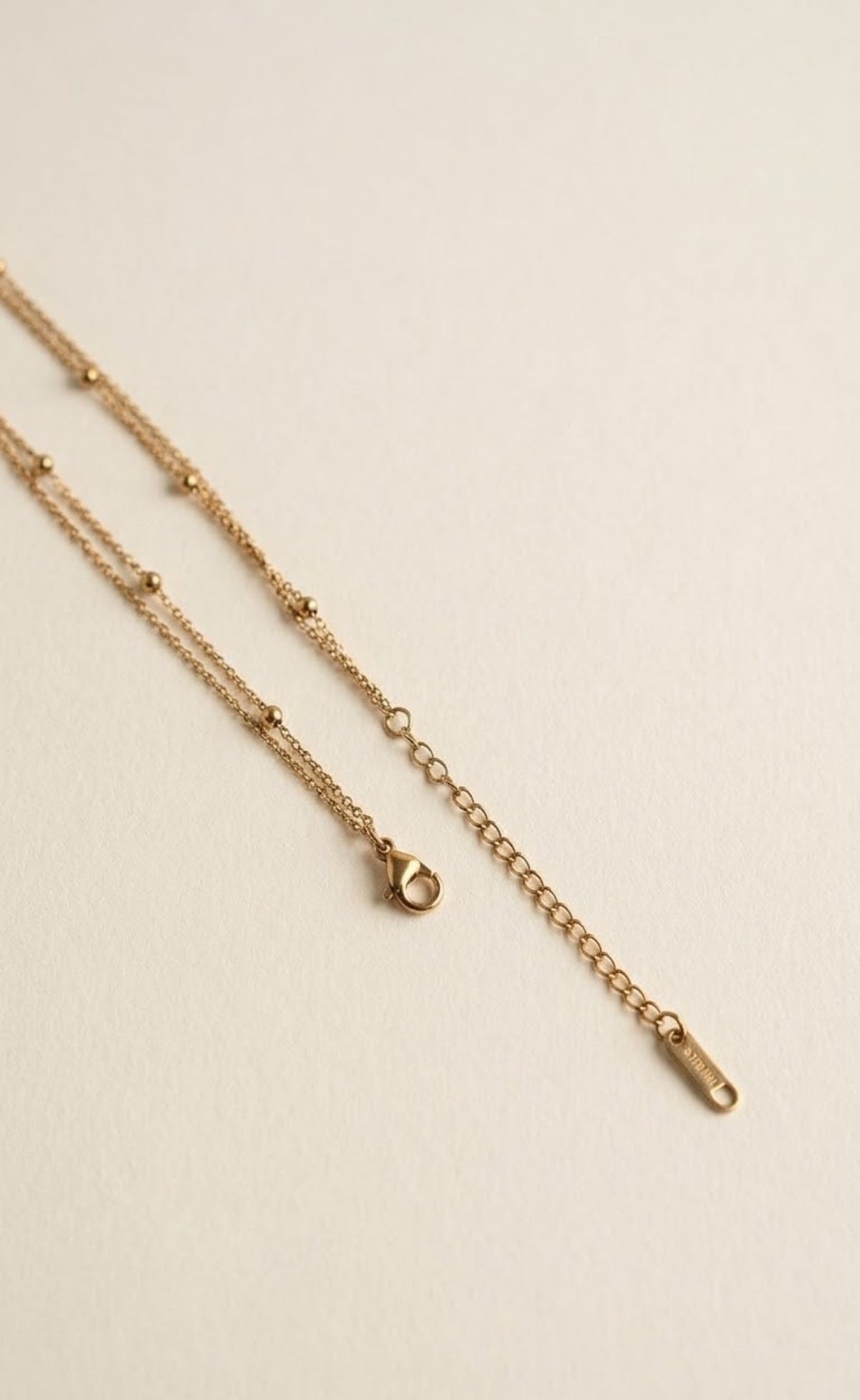 Double gold-tone waist chain with faux pearls and butterfly tassel drop - view 3
