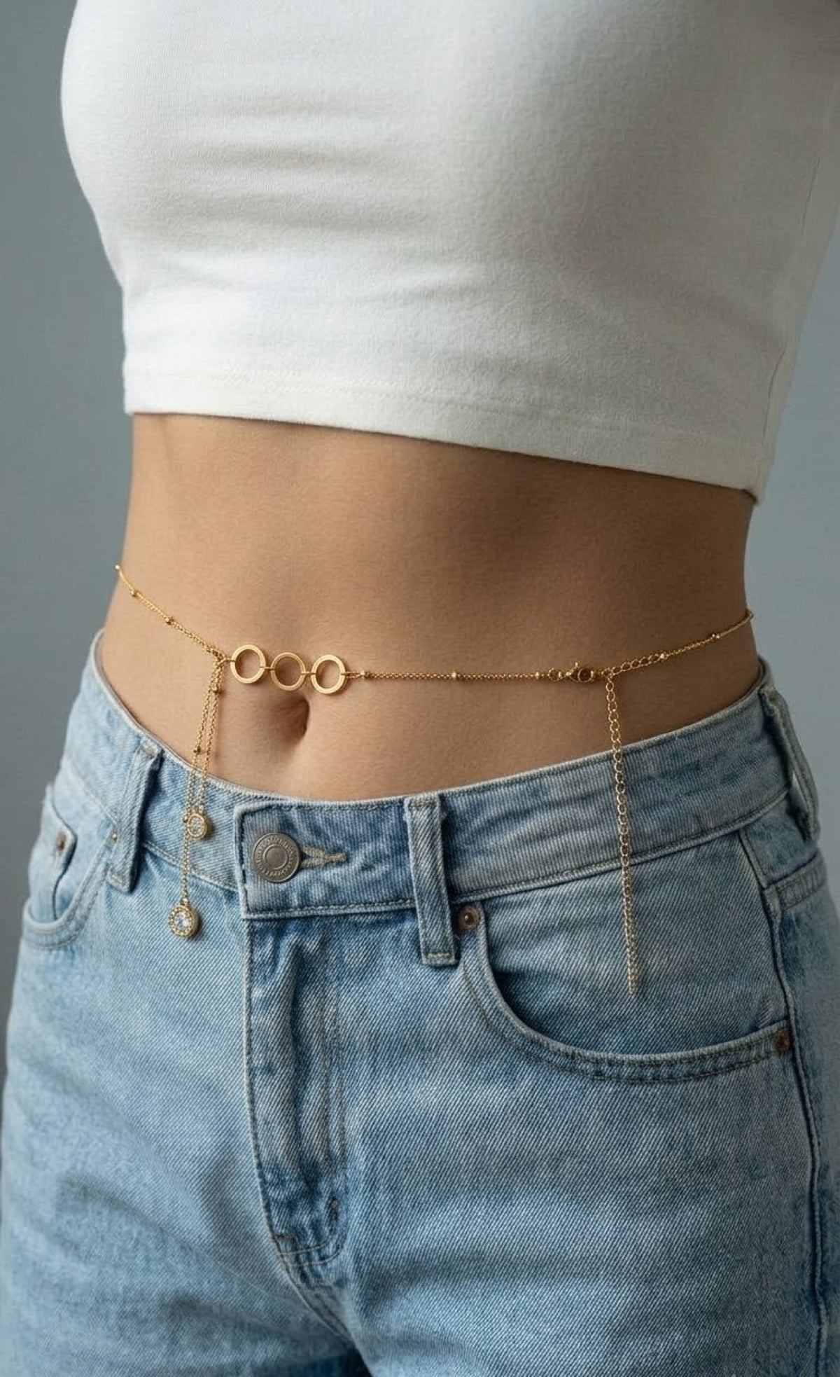 Gold-tone satellite waist chain with triple ring centre and crystal drops