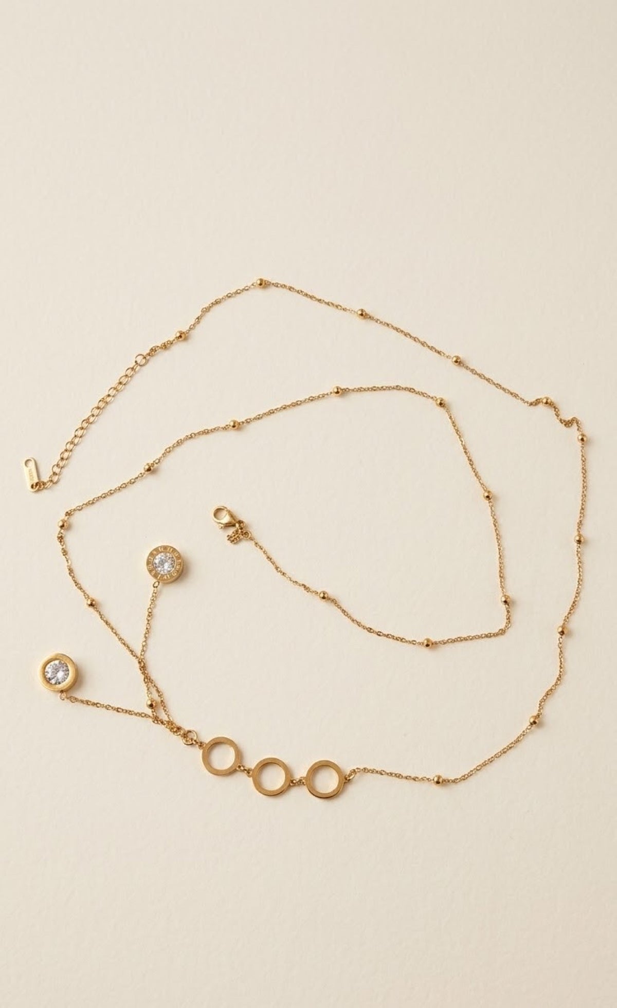 Gold-tone satellite waist chain with triple ring centre and crystal drops - view 2